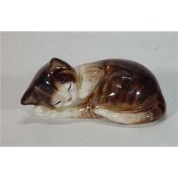 Hand painted Royal Doulton sleeping black and white cat, 8cm in length, marks to base…