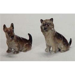 Two hand painted Royal Doulton seated terrier dogs, 6cm high…