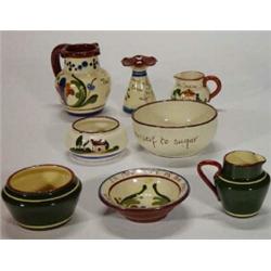 Selection of eight pieces of mottoware including puzzle jug, ashtrays, jugs, bowls, etc…