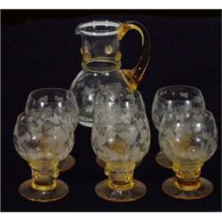 Seven piece amber and clear glass lemonade set comprising jug and six goblets, etched with leaves…