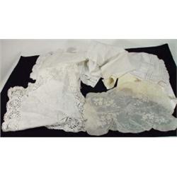 Selection of assorted linen and lace, floral tablecloths, etc…