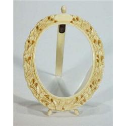 Floral carved oval ivory photo frame, 11cm high…