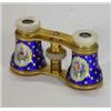 Pair of brass and mother-of-pearl opera glasses, enamelled with panels of flowers onto a gilt and…