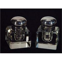 Pair of square cut glass inkwells with silver plated tops…