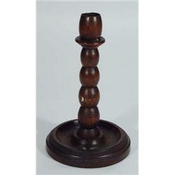 Turned oak circular based candlestick, 23cm high…