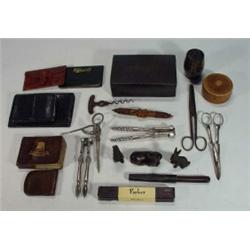 Tray of assorted items including carved wooden needlecase, nutcrackers, Parker pen, cast metal ra…