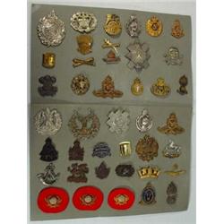 Two sheets of miliary badges including British Road Services, Tank Corps, Service Corps, etc…