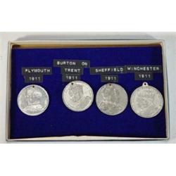 Three Coronation medals and a City of Winchester 1911 medal…