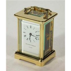 Matthew Norman, London, brass carriage clock with bevelled glass panels and swing handle, 16cm hi…