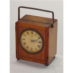 Wooden cased mantelclock with swing handle, 10cm high…