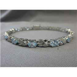 Oval cut Blue Topaz & Diamond tennis bracelet