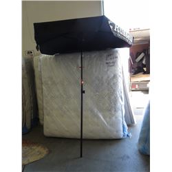 Patio umbrella with Russell Brewing Company logo