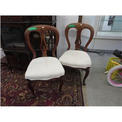 2 Vintage oak chairs with carved detail