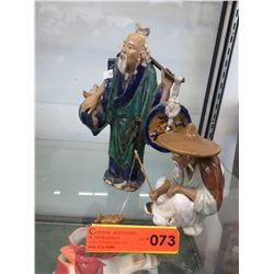 2 Glazed mud men statues