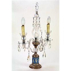 A cut glass table lustre in late 18th century style, with a spirally reeded finial, two candle br...