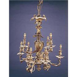 An  ormolu chandelier in rococo style, cast overall with acanthus scrolls, with a central baluste...