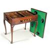 A 19th century Dutch mahogany games table, the rectangular reversible top with a gallery to one s...