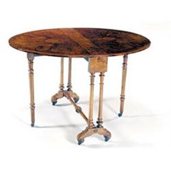 A Victorian burr walnut oval drop leaf tea table, the quarter veneered top crossbanded and boxwoo...