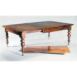 An early Victorian mahogany extending dining table, with three loose leaves, the rectangular top...