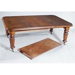 An early Victorian mahogany extending dining table with two loose leaves, the rectangular top wit...