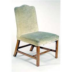 A George III mahogany side chair, with upholstered serpentine back and seat on straight chamfered...