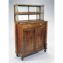 A Regency rosewood and brass chiffonier, the raised back with two shelves and pierced brass three...