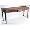 Image 1 : A mahogany serving table in George III style, the serpentine top above a fluted frieze with a cen...