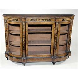 A Victorian walnut and floral marquetry credenza with gilt metal mounts, the glazed door enclosin...