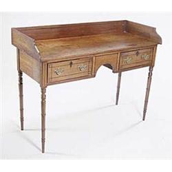 A George IV mahogany and ebony strung side table with a three-quarter gallery above two short  dr...