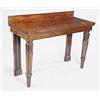 Image 1 : A William IV mahogany serving table with a raised back and plain frieze on turned legs carved wit...