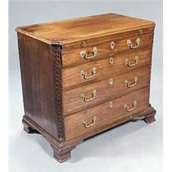 A George III mahogany chest, the top with a moulded edge above a slide and four long graduated dr...