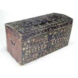 An 18th century leather and brass studded trunk with a domed hinged top, 58 high x 108cm wide, (s...