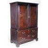 Image 1 : A mahogany wardrobe with a dentil cornice above two panelled doors, a false drawer and a long dra...
