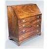 A George III mahogany bureau, the fall enclosing interior fittings above four long graduated draw...