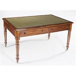 A Victorian mahogany writing table, with a leather inset and rounded corners above two short draw...