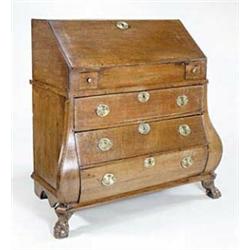 An 18th century Dutch oak serpentine bureau, the fall enclosing a well and stepped interior fitti...