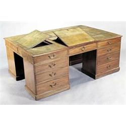 An early 19th century mahogany partners' pedestal desk of large proportions, the rectangular cros...