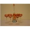 Image 1 : Cut and clear glass cranberry decanter and six matching long stem glasses with star cut bases, ci…