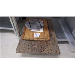 SLAB OF GRANITE, ROUND PIECE OF MARBLE, ONE WOODEN CUTTING BOARD, AND ONE PLASTIC CUTTING BOARD.