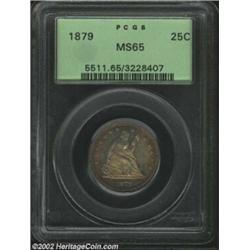 1879 25C MS65 PCGS. The gorgeous tobacco-brown patina is lighter in the centers. A boldly struck and