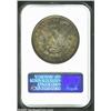 Image 2 : 1884-O S$1 MS65 NGC. Luminous orange-gold and aqua-marine hues consume the obverse, while the revers