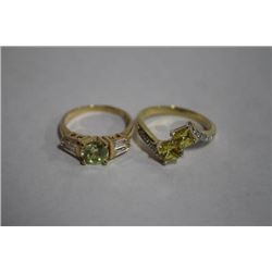 2 GOLD TONE FASHION RINGS IN BAG