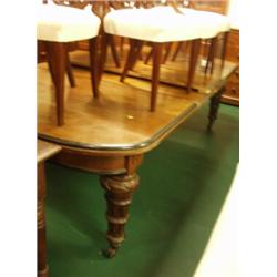 Oak wind out table with oval ends on carved and fluted legs, with three later leaves, 54"x13ft…