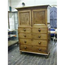 A VICTORIAN MAHOGANY LINEN PRESS, plain cornice, twin panelled cupboards opening to slide storage...