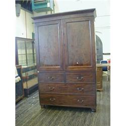 A MAHOGANY CLOTHES PRESS, c.1835, twin doors opening to an arrangement of slides, above two short...
