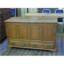 AN OAK MULE CHEST, c.1800, twin plank top, panelled sides, triple fielded panel front above two s...