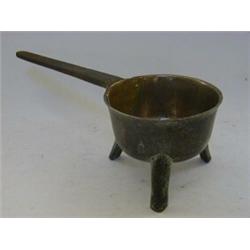 A CAST BRONZE SKILLET, c.1650, (later repaired with rivets to cast iron handle) height 12cm  £30-...
