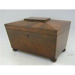 A MAHOGANY TEA CADDY, c.1840, sarcophagus shape, twin lidded compartments, bun feet, width 25cm  ...