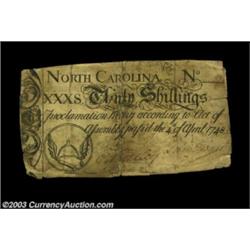 North Carolina April 4, 1748 30s Fine, damaged. The text is complete and the winged stirrup vignette