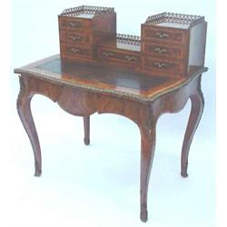 A Victorian burr walnut bureau de dame of serpentine form, tulipwood-banded and ormolu-mounted, t...